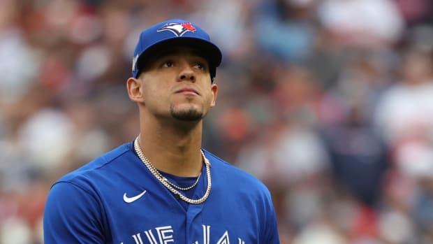Blue Jays pitcher Jose Berrios walks off the field.